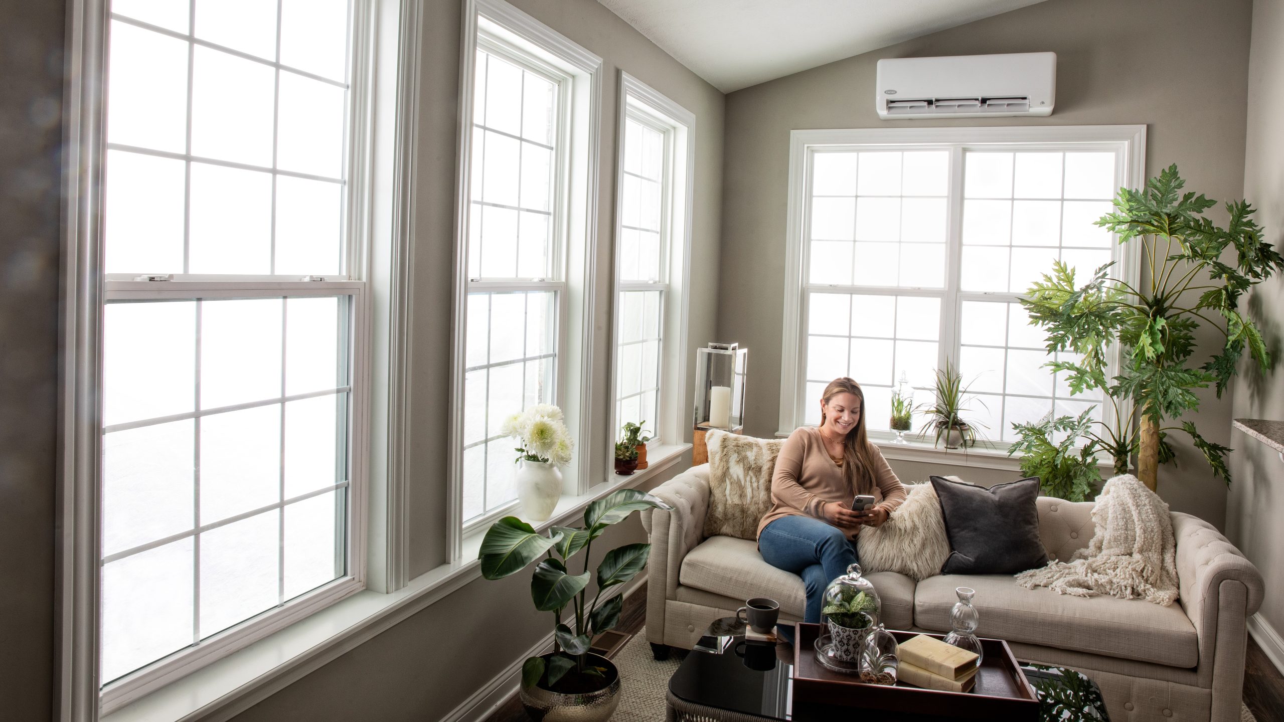 Woman in room with heat pump